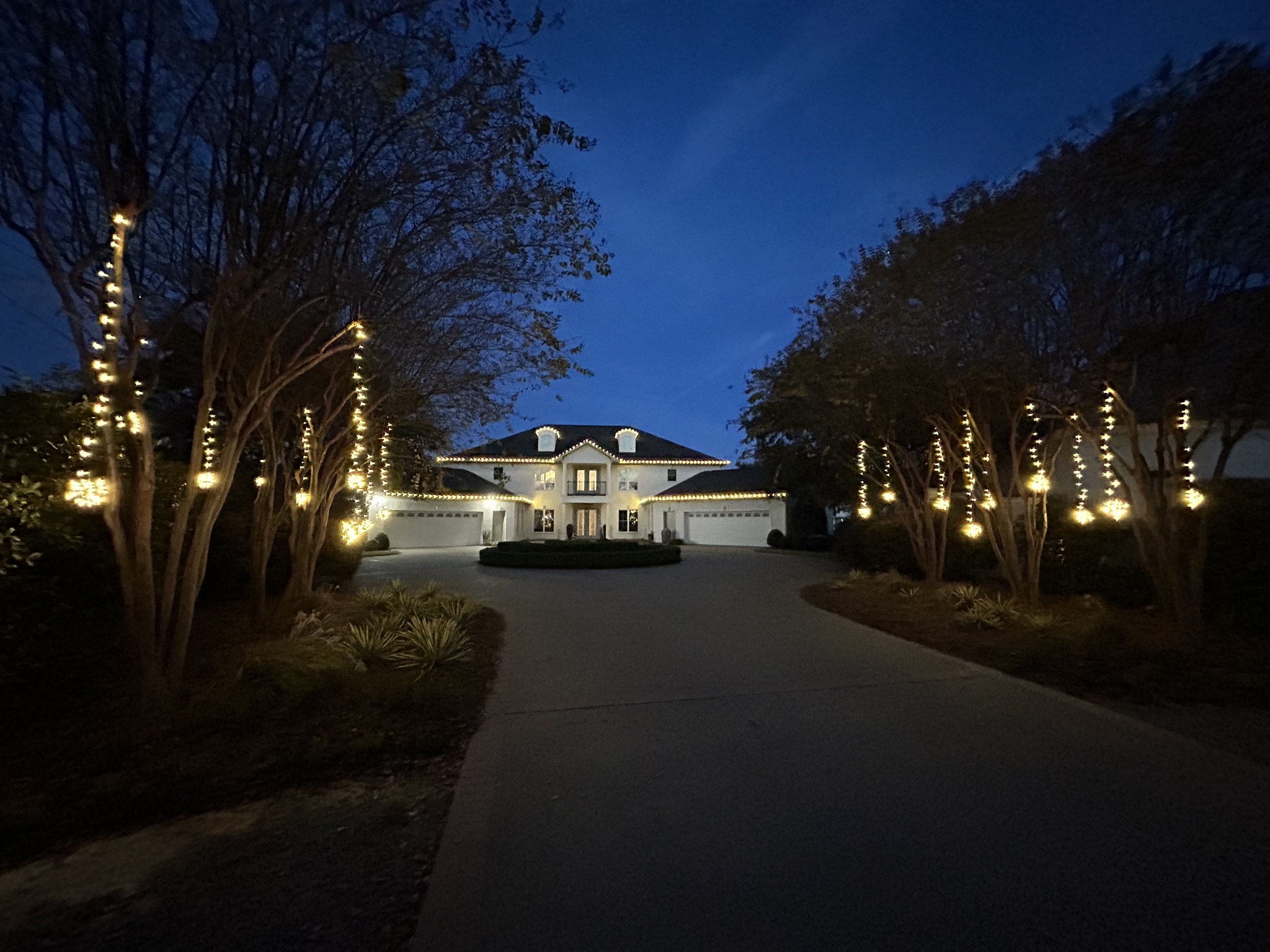Home decorated with Christmas lights at night