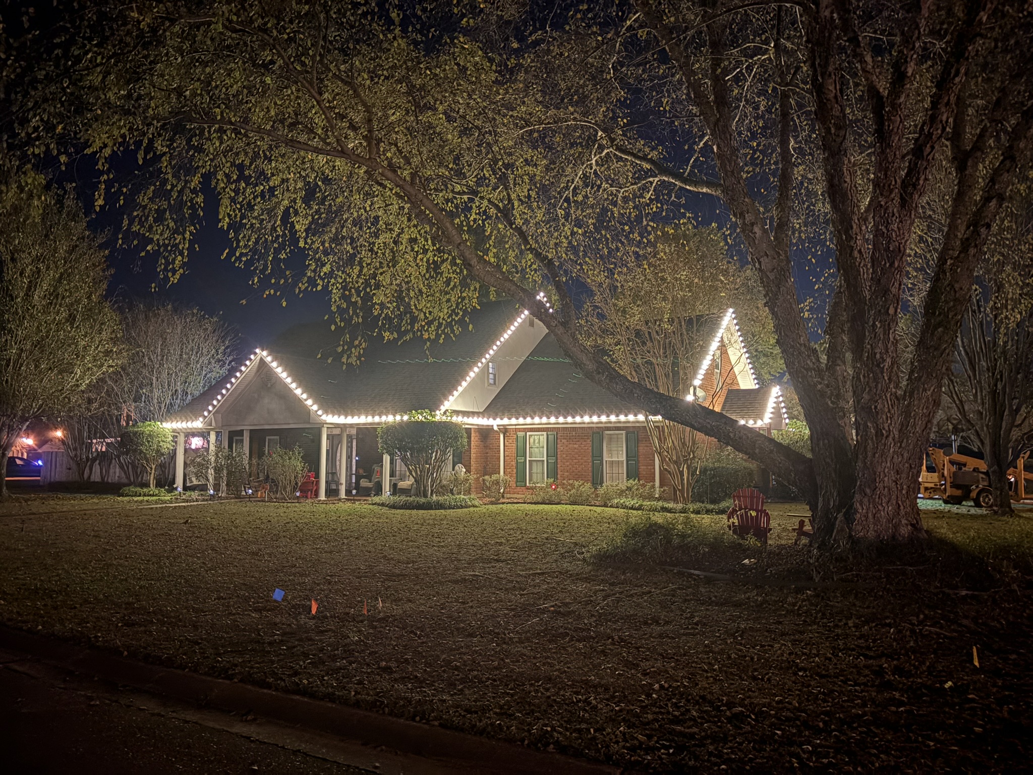 Home decorated with Christmas lights at night
