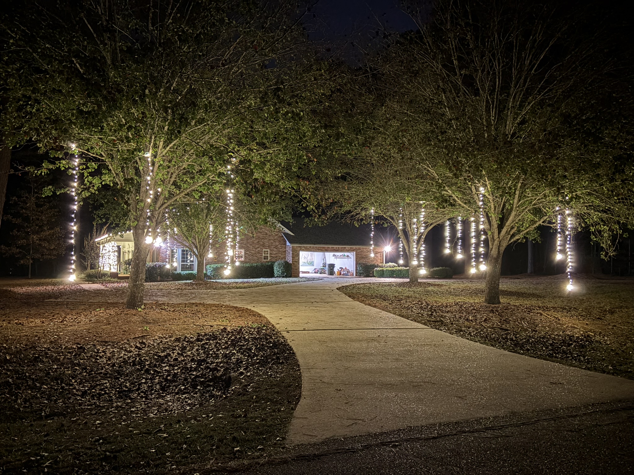 Home decorated with Christmas lights at night